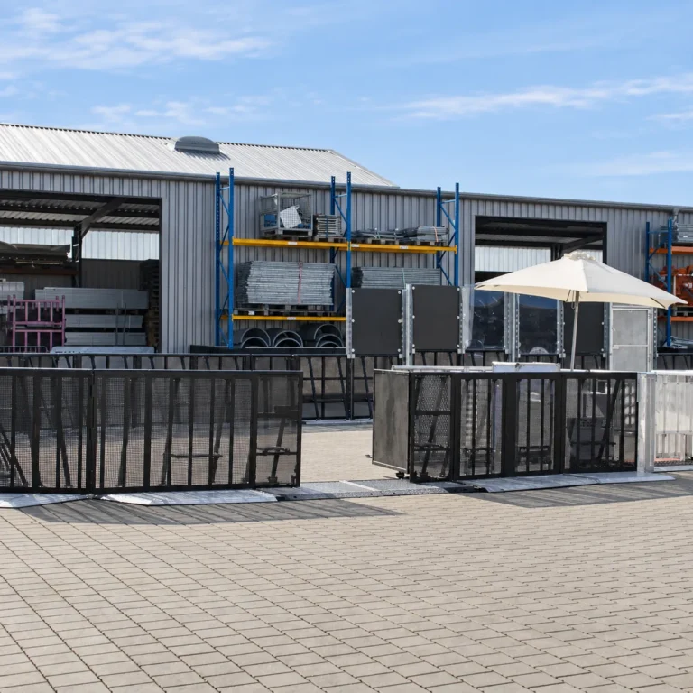 Black Mojo Barrier Alternative Doors in a barrier line outside a warehouse