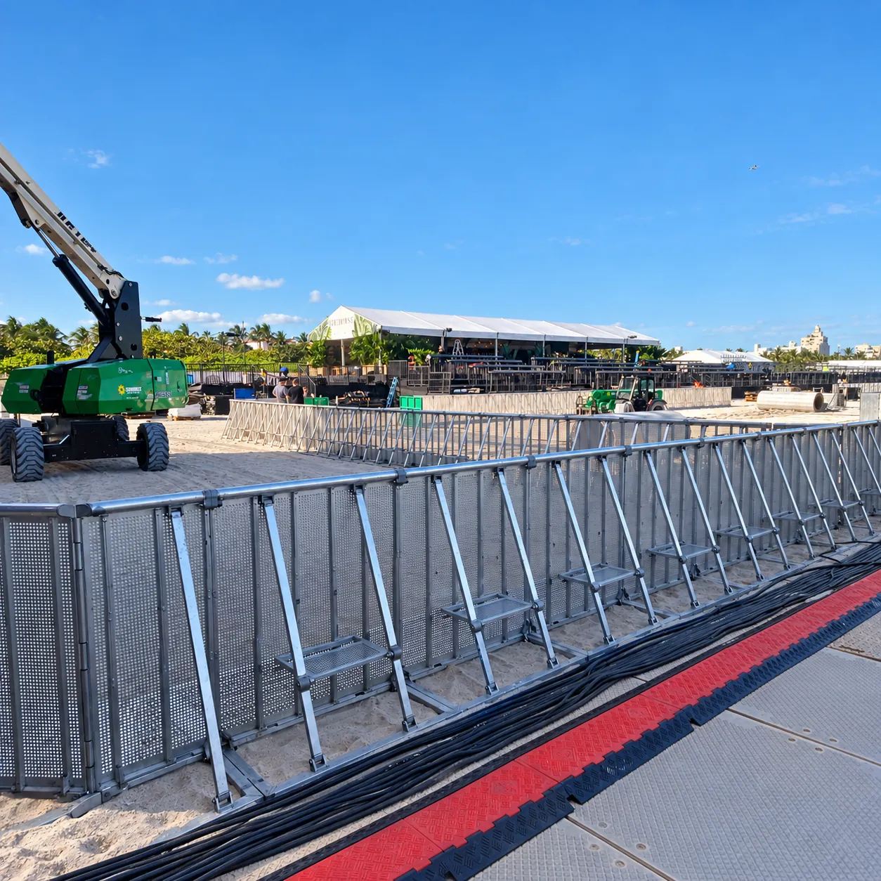 Aluminium Mojo Barrier line with cable ramp on a beach event site