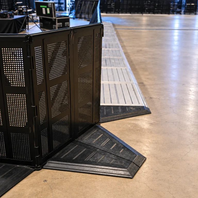 Corner of a black Mojo Barrier line with base plates, detail