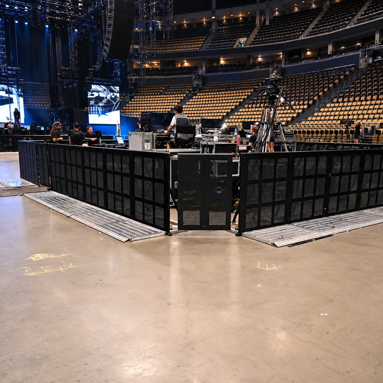Black Mojo Barrier enclosure with door around the front-of-house desk in an arena