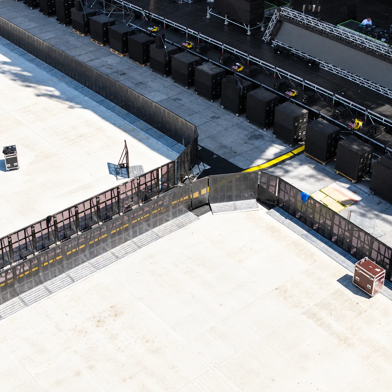Black Mojo front-of-stage barrier in front of a stage, seen from above