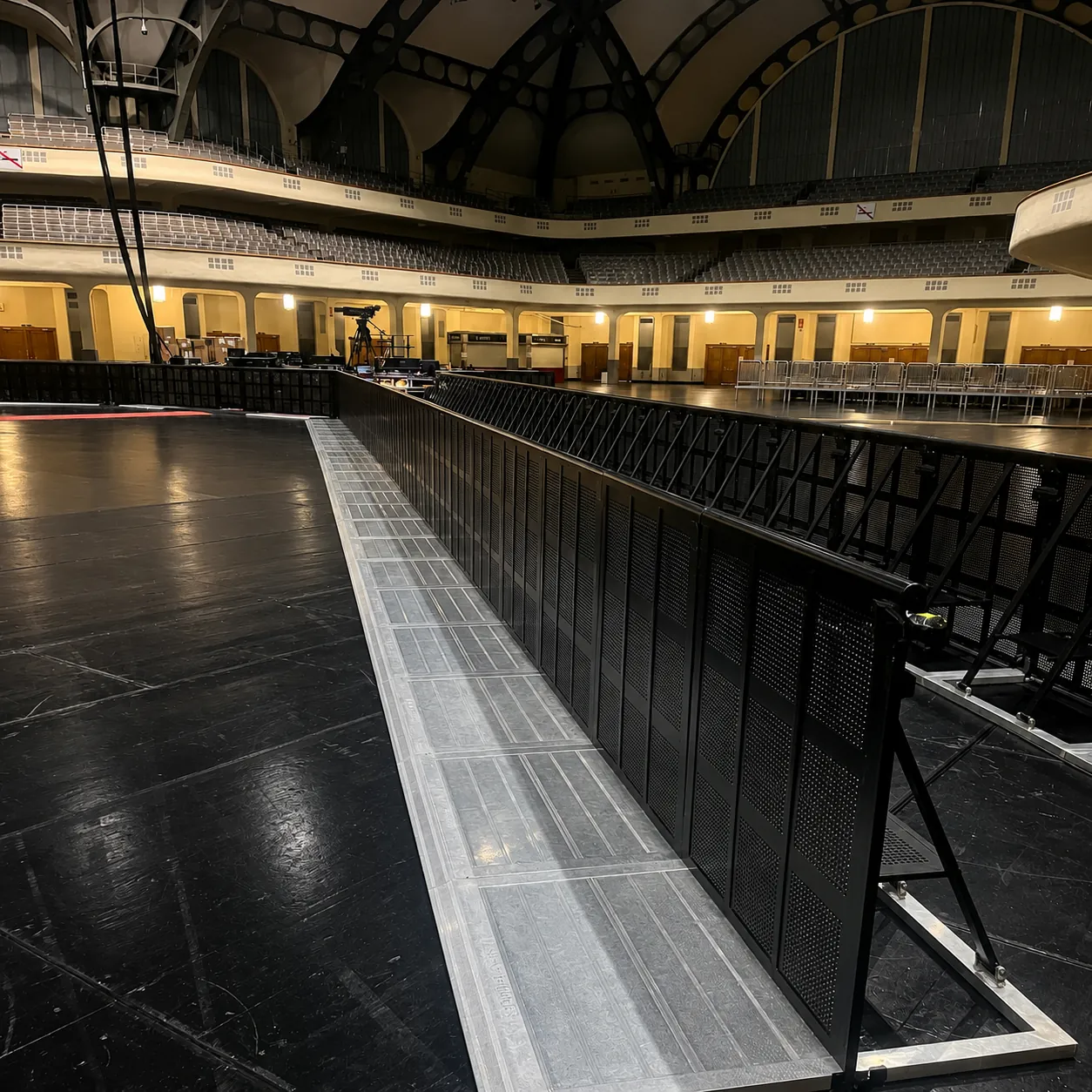 Black Mojo Barrier line with silver floor plates in a historic event hall