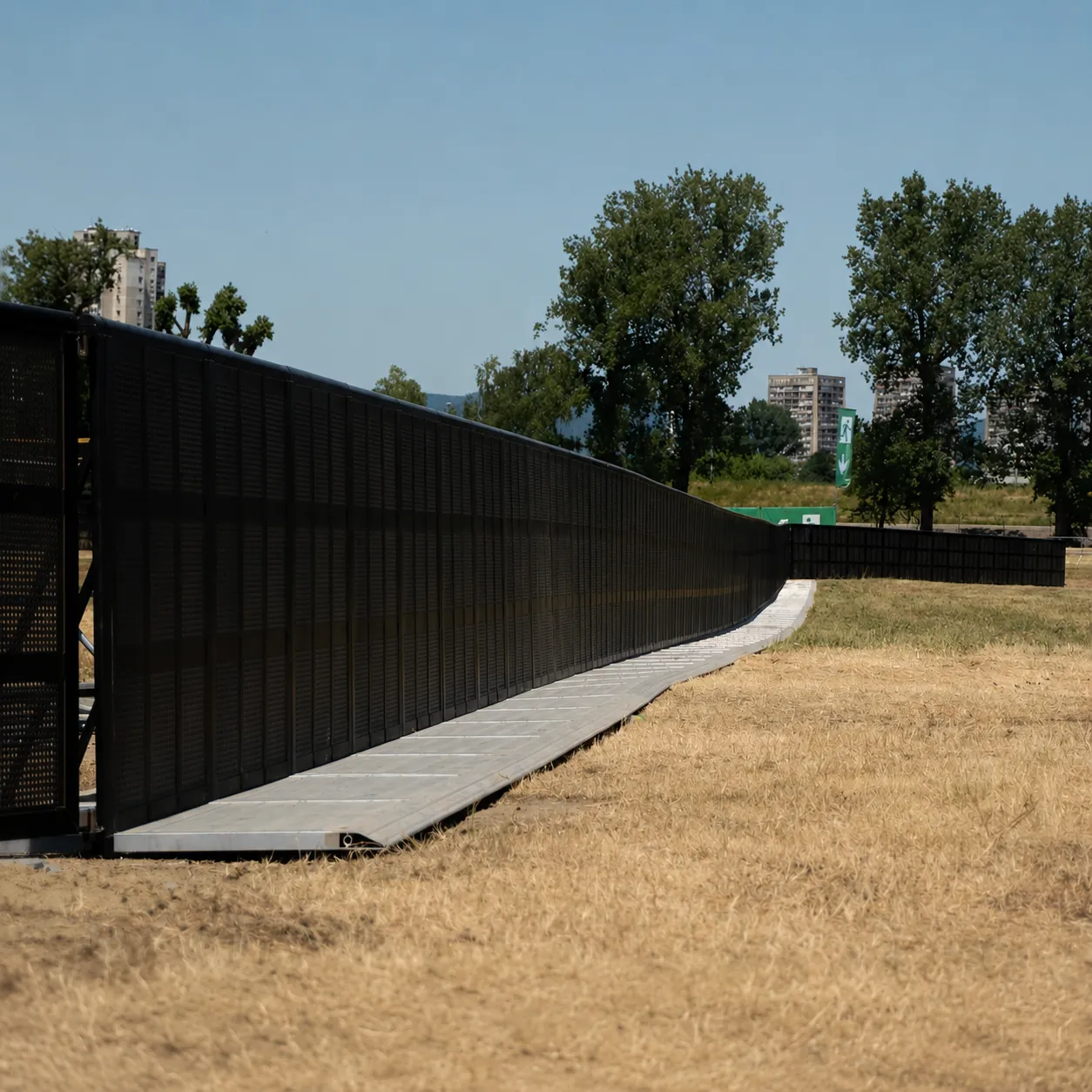 Long black Mojo Barrier line on an open field