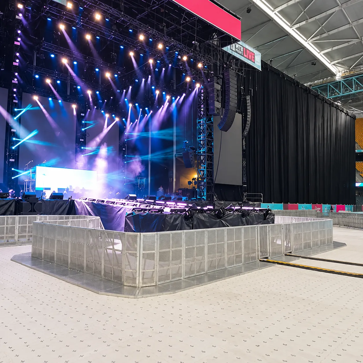 Mojo Barriers enclosing the stage area in a stadium