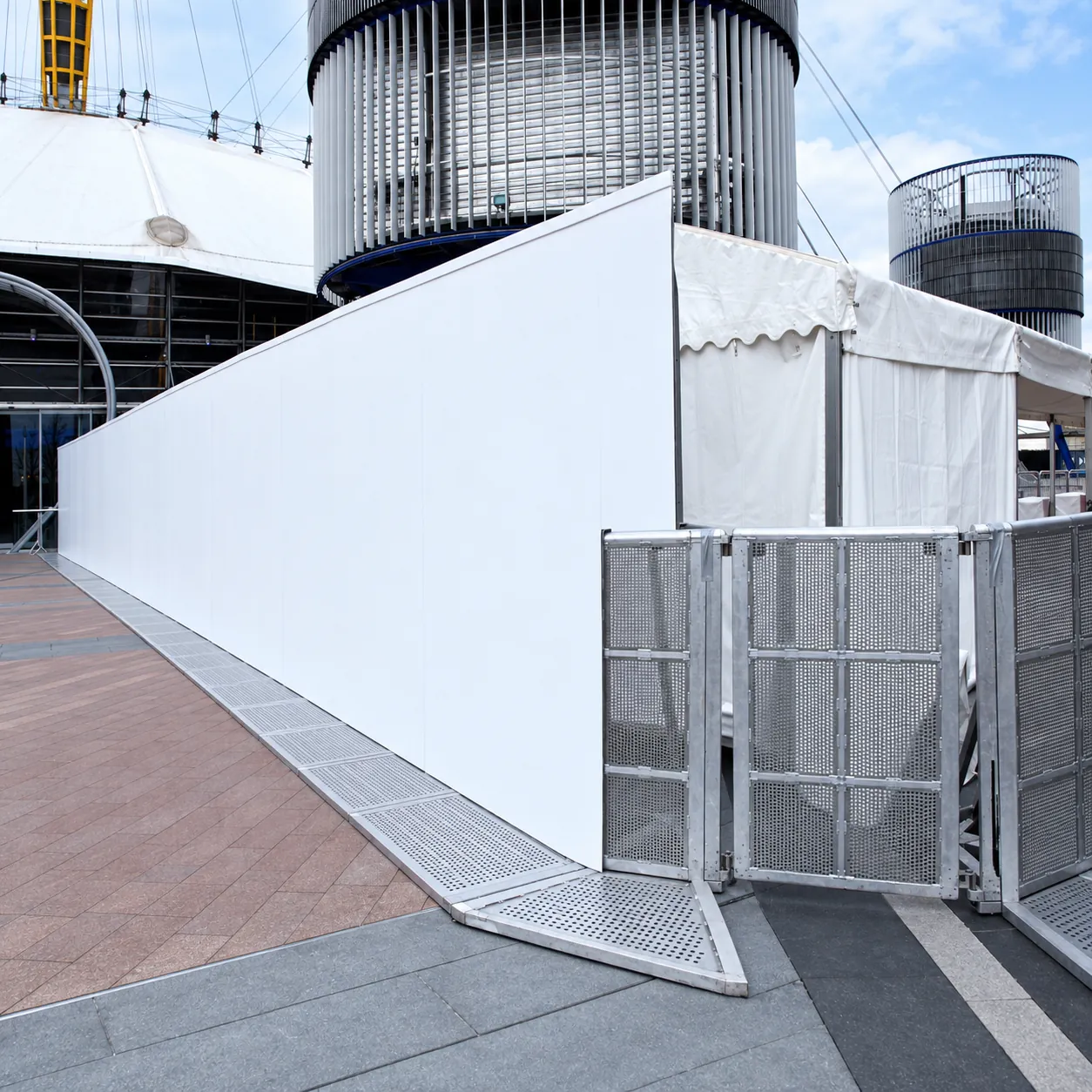 Mojo Barrier gate with white screening panels at a venue entrance