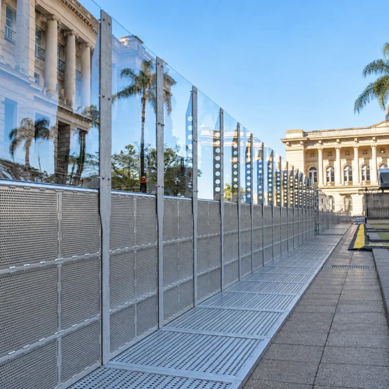 Mojo High Fence with clear upper panels in front of a historic building