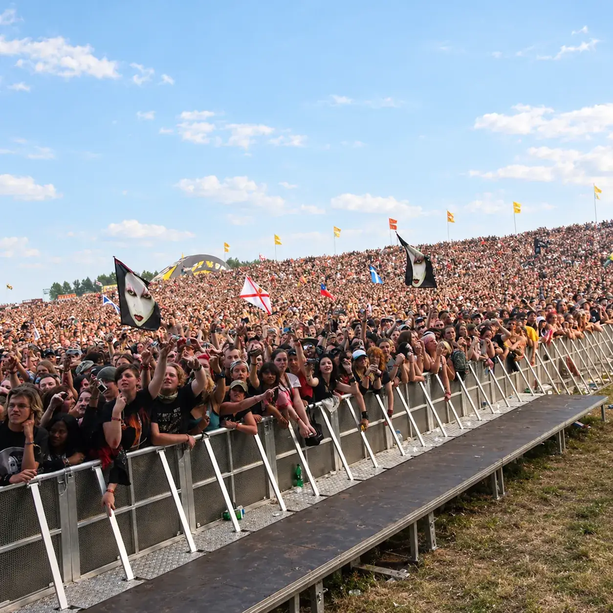 Large festival crowd behind an aluminium Mojo Barrier line