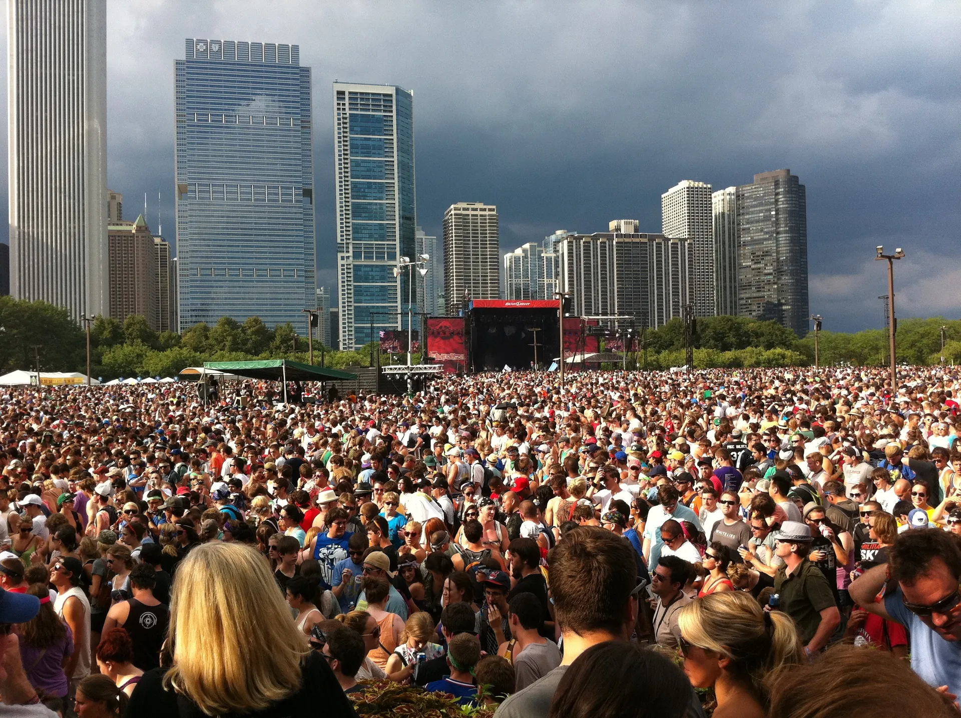 Crowd in front of a main stage at Lollapalooza 2011, with the Chicago skyline behind